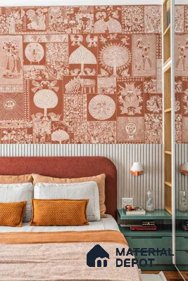 Eclectic bedroom with Indian patterned wallpaper, rust upholstered headboard, and sage green side tables