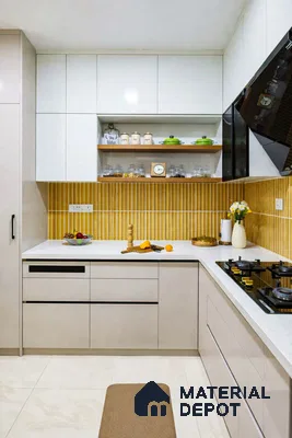 Modern kitchen with white laminate cabinets, yellow kitkat backsplash tiles, and white quartz countertop