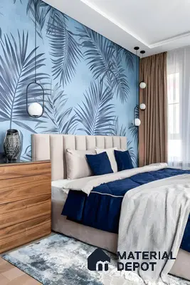 Modern bedroom with blue tropical wallpaper, beige upholstered headboard, and natural wood chest of drawers of 3 BHK apartment in IBC Platinum City Yeshwanthpur Bengaluru