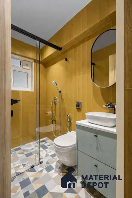 Modern bathroom with mustard yellow wall tiles and geometric patterned floor tiles