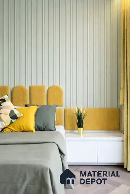 Scandinavian bedroom with sage green fluted wall panels and mustard yellow upholstered headboard