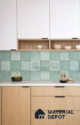 Scandinavian kitchen with patterned green backsplash tiles, white laminate cabinets, and light oak laminate base units