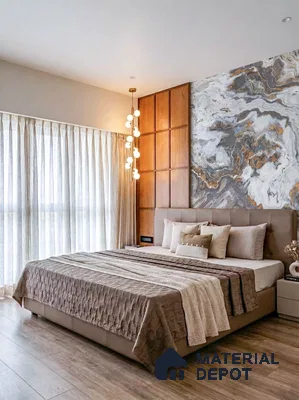 Modern bedroom with marble-look accent wall, wooden paneling, and light oak wooden flooring