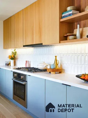 Scandinavian kitchen with light oak laminate, pastel blue laminate, and white textured backsplash tile