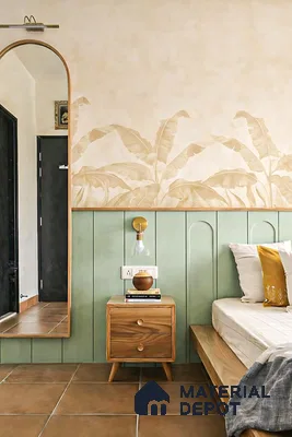Scandinavian bedroom with sage green wall panels, beige tropical wallpaper, and natural wood furniture