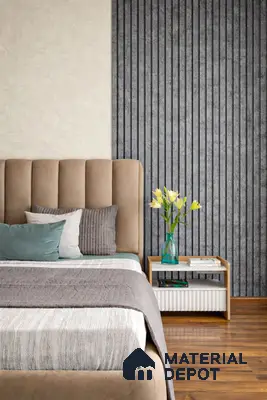 Minimalist bedroom with suede upholstered bed, grey fluted wall panels, and wooden flooring