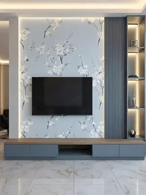 Modern TV unit with floral wallpaper, grey fluted panels, and marble floor tiles in 3 BHK apartment Jal Vayu Heights Peenya Phase 1 Bengaluru