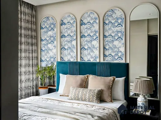 Art Deco bedroom with blue velvet upholstered bed and blue-and-white patterned wallpaper panels of 3 BHK apartment in Jana Jeeva orchid KR puram Bengaluru