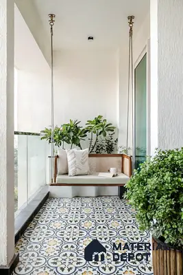 Scandinavian balcony with patterned moroccan floor tiles and wooden swing