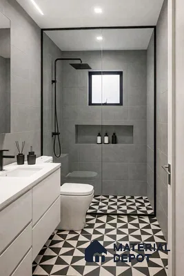 Minimalist bathroom with grey wall tiles, white vanity, and black-and-white geometric patterned floor tiles