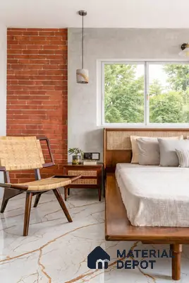 Mid-century modern bedroom with cane furniture, exposed brick wall, and marble-look floor tile