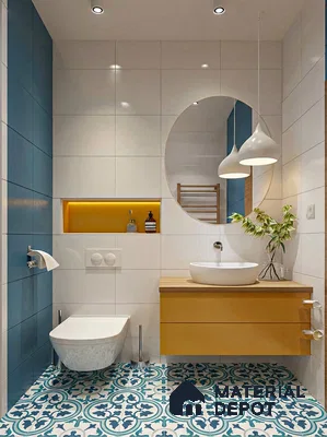 Modern bathroom with blue patterned floor tiles, white wall tiles, and mustard yellow floating vanity