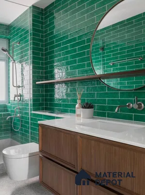 Modern bathroom with emerald green subway wall tiles, white quartz countertop, and walnut wood vanity