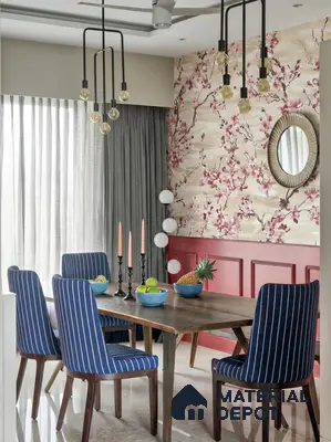 Eclectic dining room with floral wallpaper, wooden dining table, and striped blue upholstered chairs