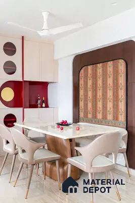 Art Deco dining room with marble tabletop, beige and gold accent chairs, and floral patterned wallpaper