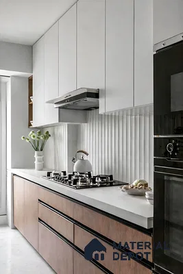Modern kitchen with frosty white laminate, wood laminate base cabinets, and white fluted backsplash tile