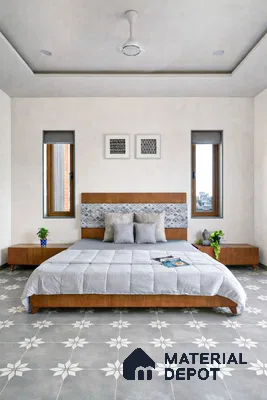 Minimalist bedroom with grey and white floral patterned floor tiles and walnut wood bed