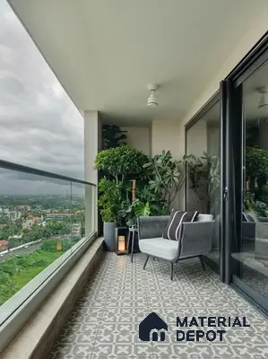 Modern balcony with grey patterned floor tiles and glass railing
