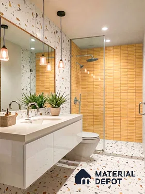 Modern bathroom with yellow geometric wall tiles and terrazzo floor and wall tiles
