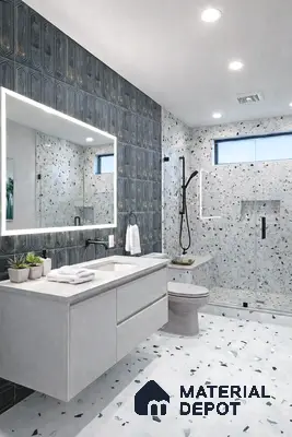 Modern bathroom with terrazzo wall and floor tiles and geometric dark accent tile