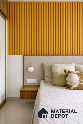 Modern bedroom with mustard yellow fluted wall panels and beige upholstered headboard