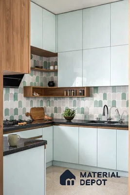 Scandinavian kitchen with pastel blue laminate, walnut wood accents, and green scallop backsplash tiles