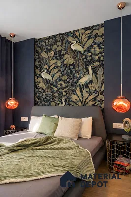 Eclectic bedroom with botanical patterned wallpaper, velvet upholstery, and warm metallic accents