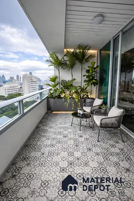 Modern balcony with geometric patterned floor tiles and minimalist outdoor seating