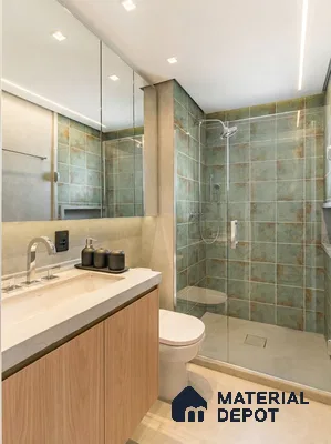 Modern bathroom with green rustic wall tiles, beige floor tiles, and light oak laminate vanity