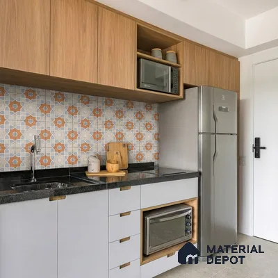 Modern kitchen with light wood laminate, patterned moroccan backsplash tile, and black granite countertop