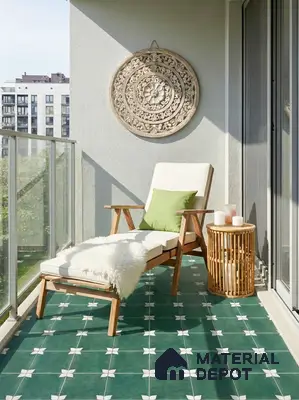 Scandinavian balcony with green patterned floor tiles and natural wood furniture