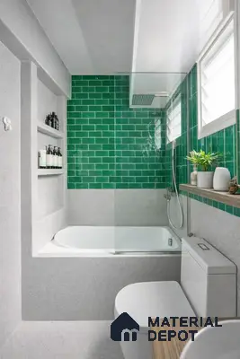 Modern bathroom with emerald green subway wall tiles and light grey terrazzo floor and wall tiles