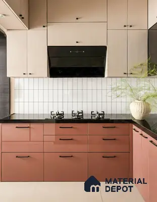 Modern dual tone kitchen with blush pink and terracotta glossy laminate, black granite countertop, and white subway backsplash tiles of 2 BHK apartment in Mahaveer Dazzle Mahadevapura Bengaluru