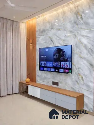Modern TV unit with white marble laminate, walnut wood laminate, and gold accent wall in 3 BHK apartment Maithri Shilpitha Splendour Mahadevapura Bengaluru