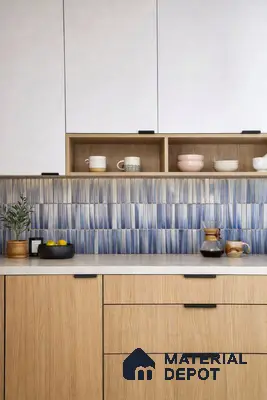 Scandinavian kitchen with oak wood laminate, white laminate cabinets, and blue kitkat backsplash tiles