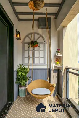 Scandinavian balcony with beige chevron floor tiles and rattan swing chair