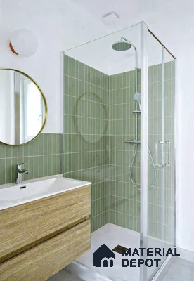 Scandinavian bathroom with sage green vertical subway wall tiles and wood-look vanity