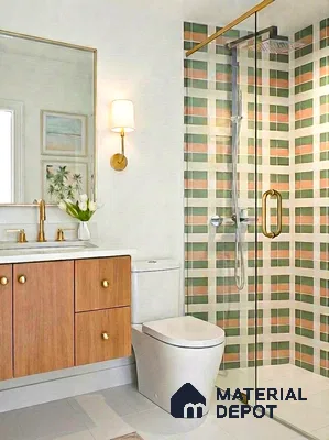 Modern bathroom with pastel green and peach geometric wall tiles and wood laminate vanity