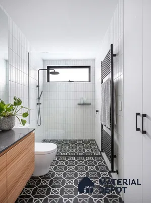 Modern bathroom with white vertical subway wall tiles, black-and-white geometric patterned floor tiles, and wood laminate vanity