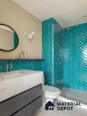 Modern bathroom with turquoise herringbone subway wall tiles and white marble countertop