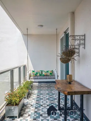 Modern balcony with geometric patterned floor tiles and live edge wooden table