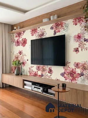 Modern living room with floral wallpaper, light oak laminate TV unit, and wooden flooring