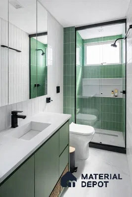 Modern bathroom with sage green subway wall tiles, white quartz countertop, and green laminate vanity