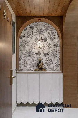 Modern pooja room with floral patterned wallpaper, white scalloped cabinet, and walnut wood arch
