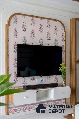Eclectic TV unit with floral patterned wallpaper and white laminate cabinet