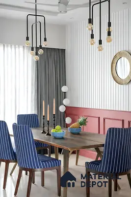 Modern dining room with striped blue fabric chairs, wooden dining table, and white fluted wall panels