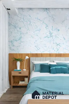 Modern bedroom with blue marble-look wallpaper and natural oak wood paneling