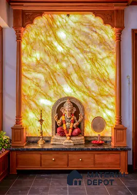 Traditional pooja room with backlit golden onyx marble panel and teak wood columns