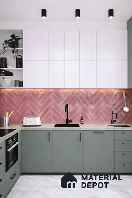 Modern kitchen with sage green laminate, white high gloss laminate, and pink herringbone backsplash tile
