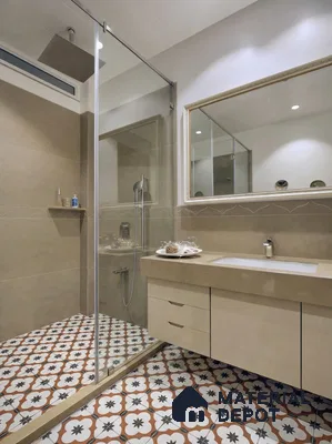 Modern bathroom with beige wall tiles, beige quartz countertop, and patterned moroccan floor tiles